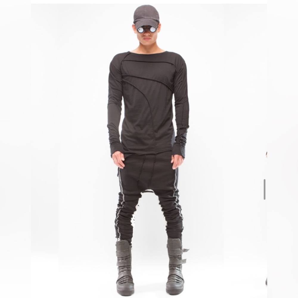 DEMOBAZA. Long sleeve angled cut at bottom w/ lined double stitching.